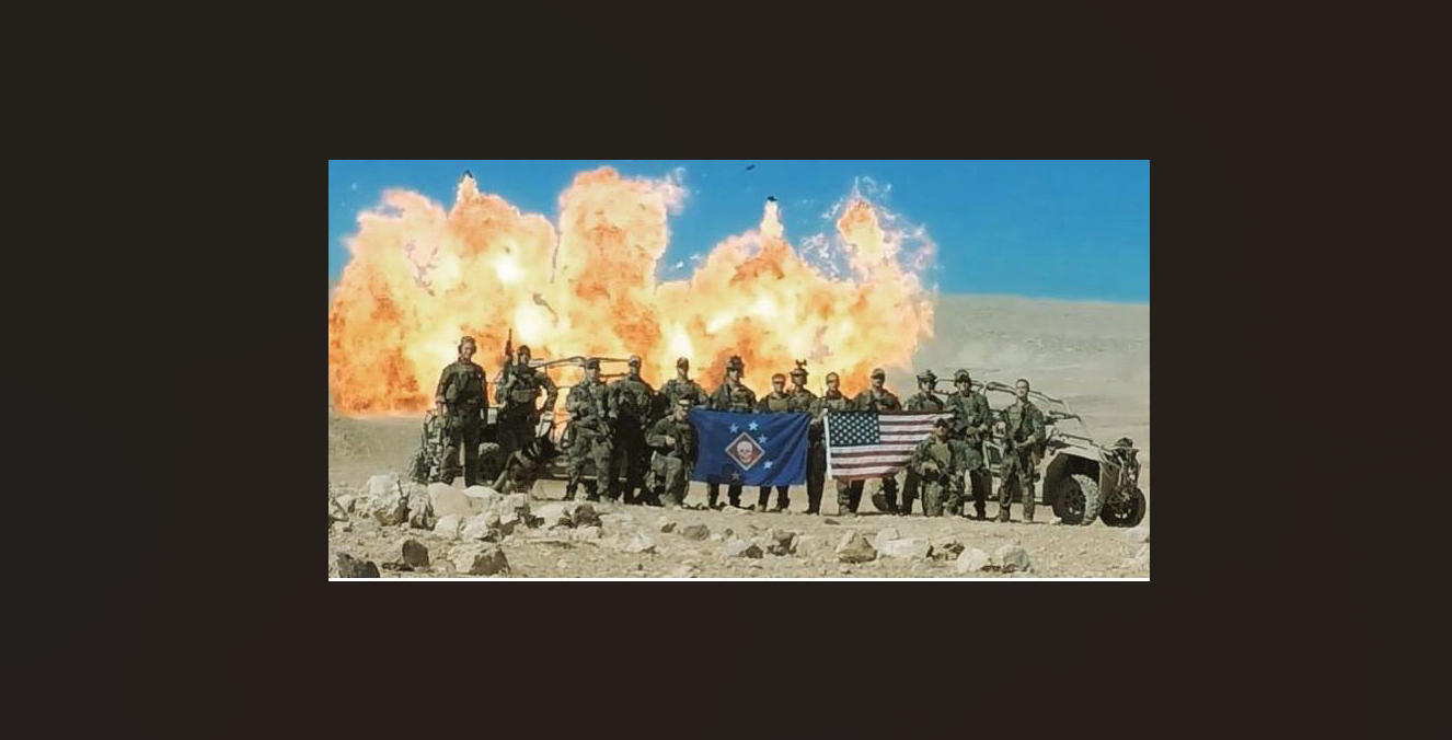 Unit photo with flags and explosion backdrop